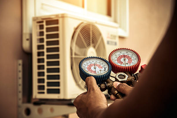 Professional Air Conditioning Service technician working in Lansing, WV